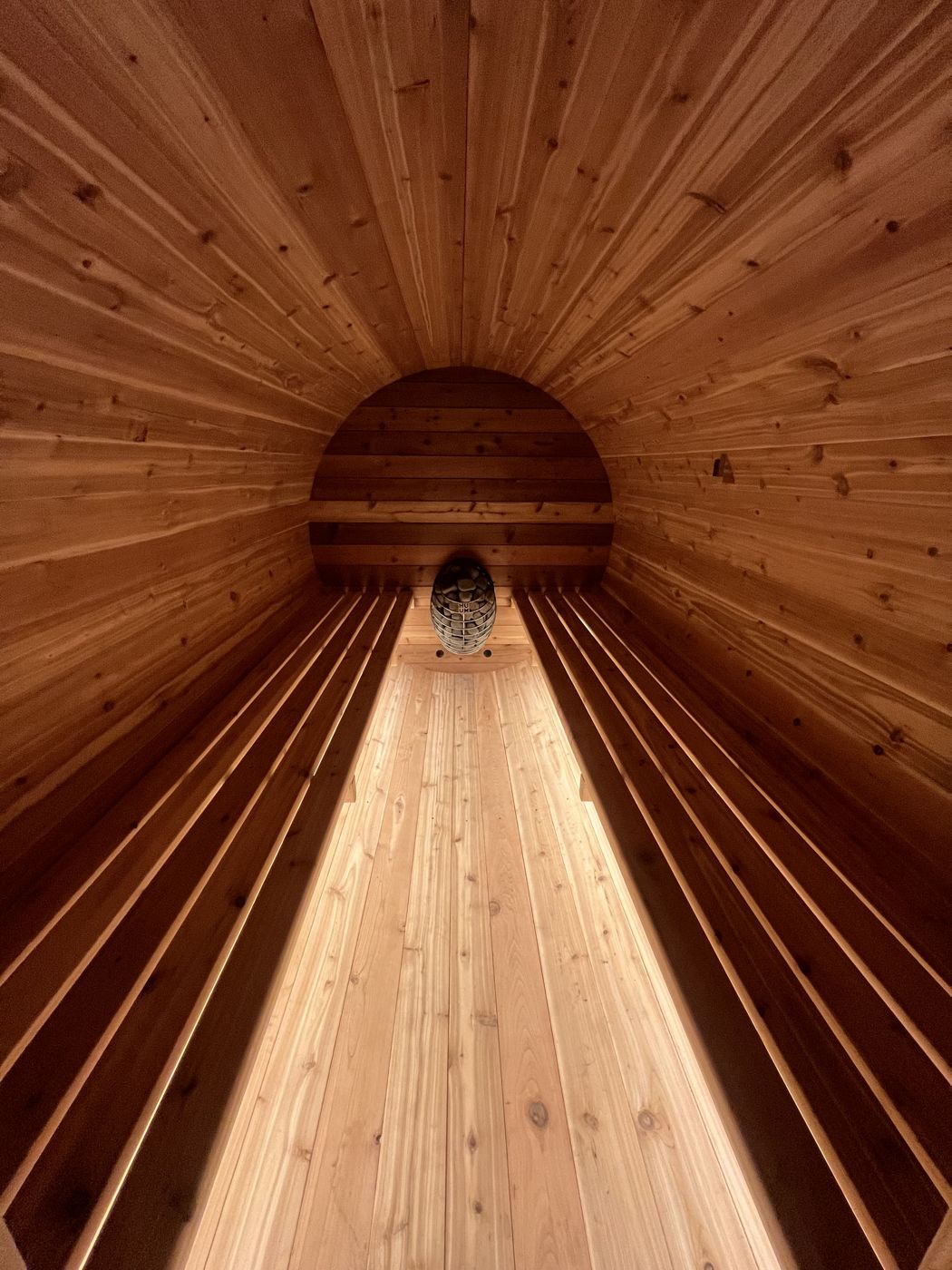 Warm cedar interior glowing from the heater