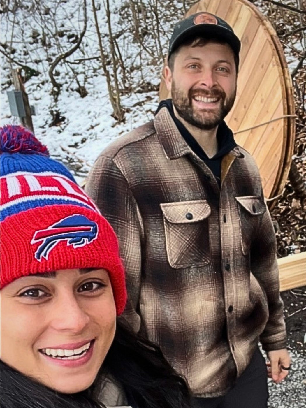 Matt and Carina in front of the barrel sauna